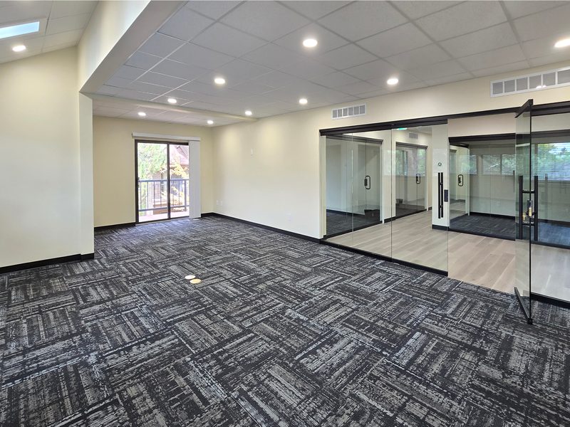 6-desk team suite with glass offices and balcony at ZipDesk Coworking