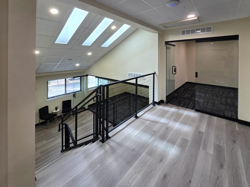 Skylit mezzanine and shared lounge at ZipDesk Coworking near the Denver Tech Center