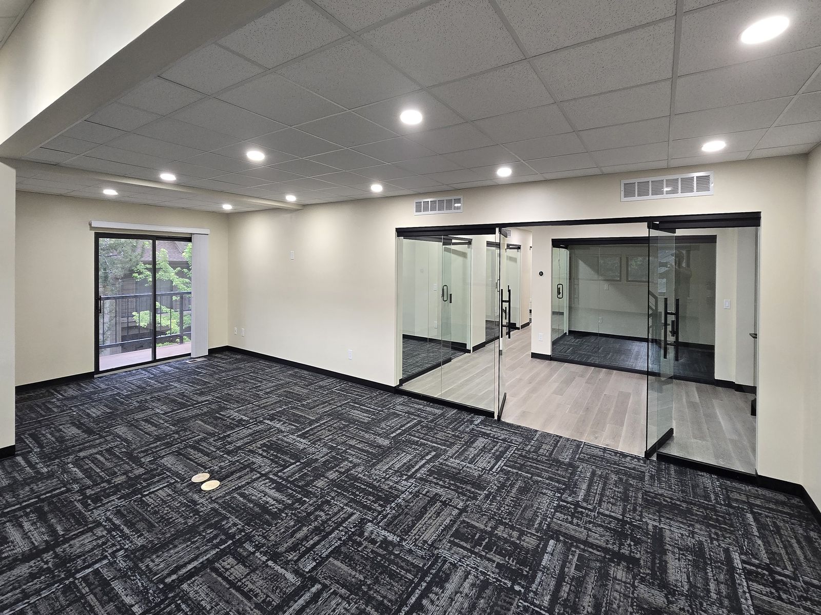 Furnished private office with natural light at ZipDesk Coworking